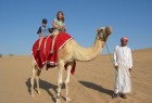 Riding a camel in Dubai